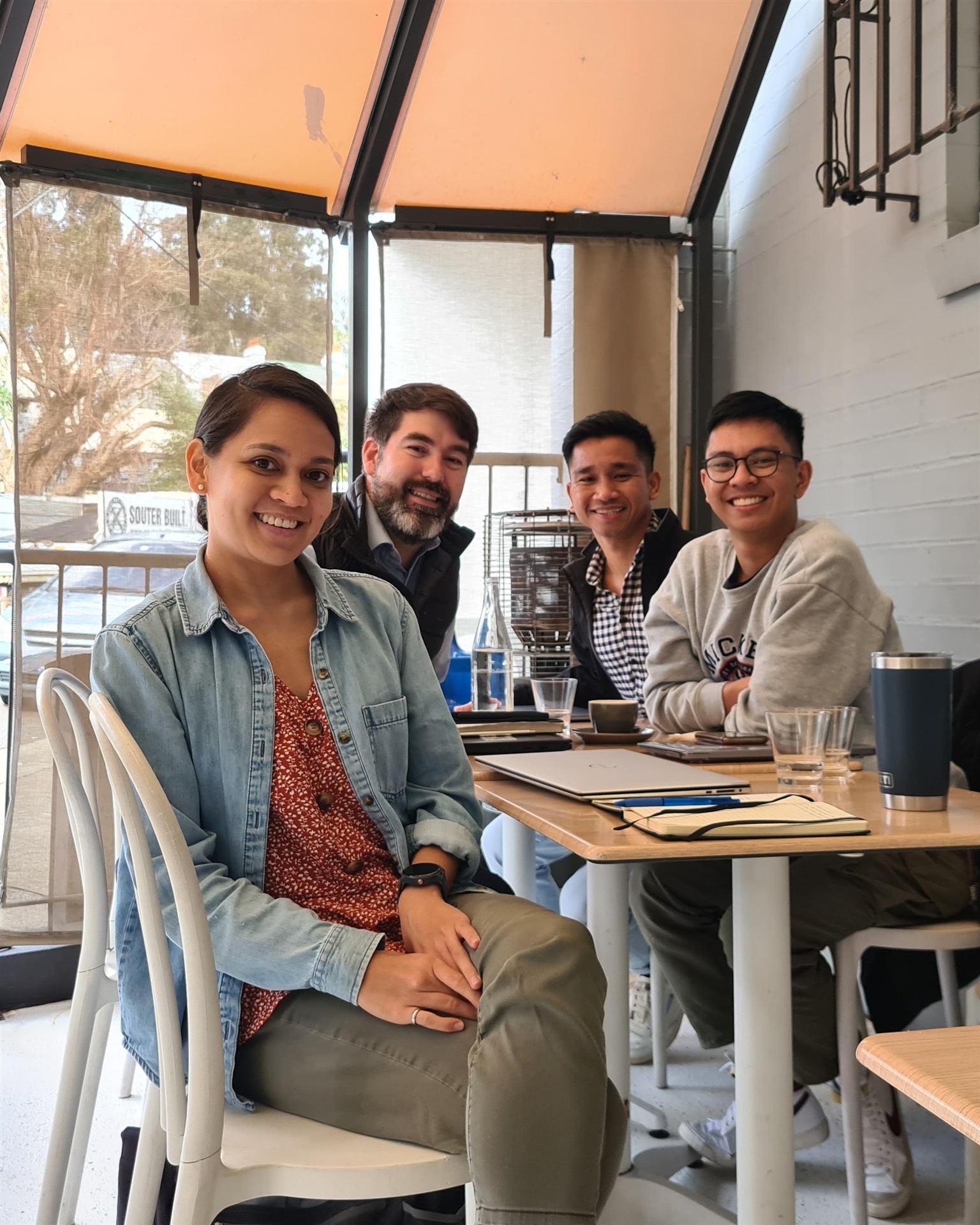 Group photo sitting at table